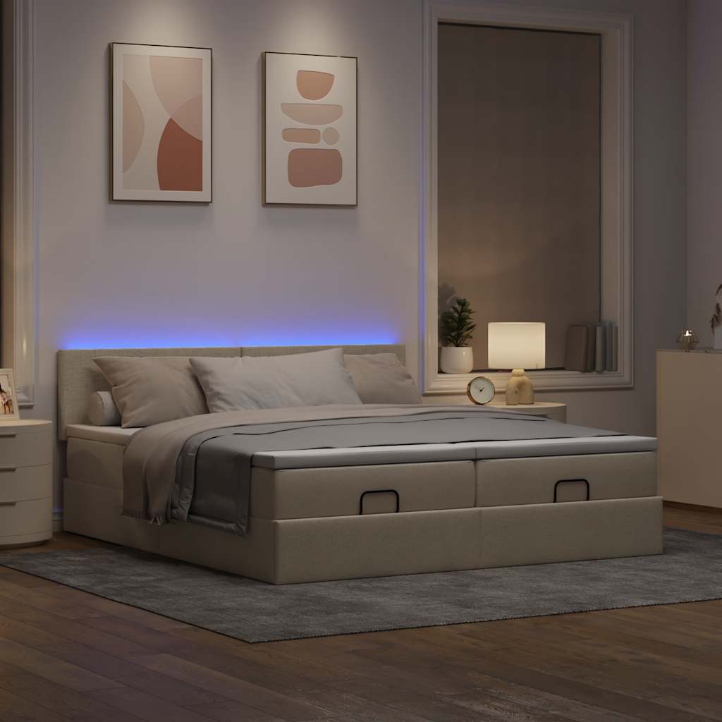 Ottoman bed met matrassen en LED's 180x200cm stof crèmekleurig